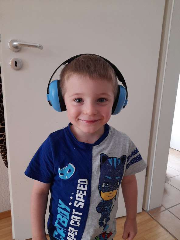 toddler wearing noise-cancelling headphones