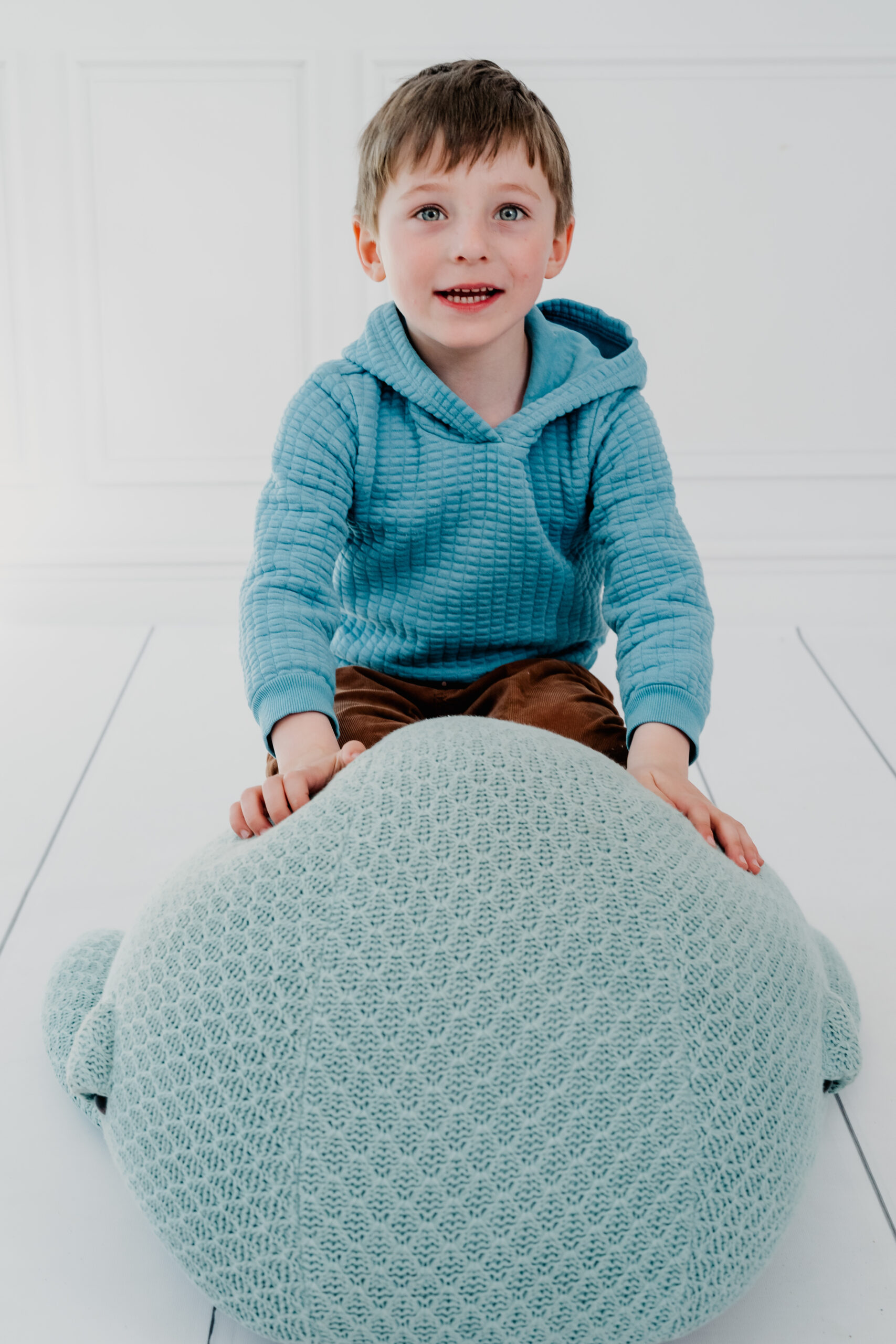 boy on whale pillow